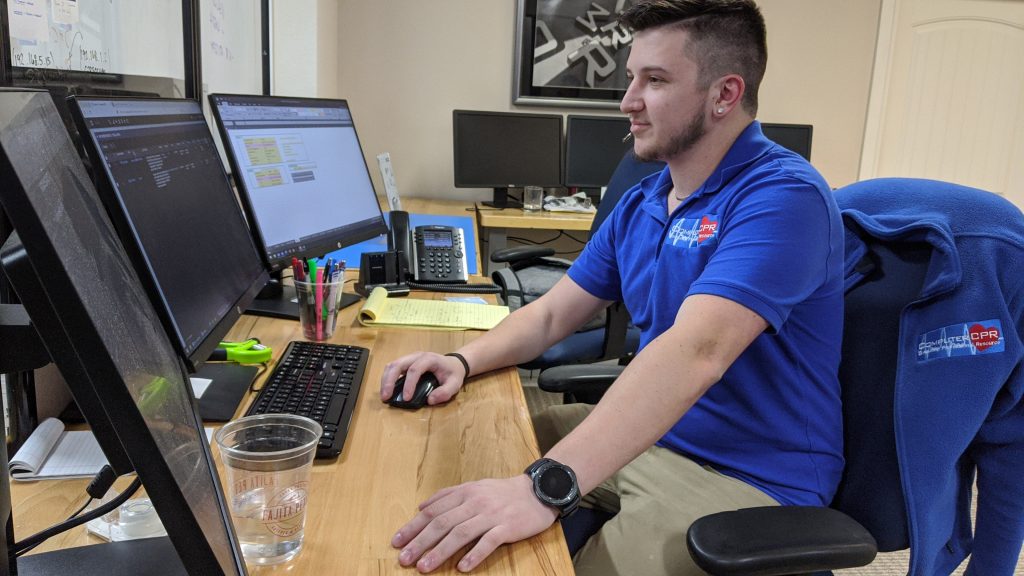 Computer CPR expert fixing computer system