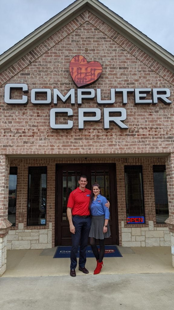 Two people outside Computer CPR shop