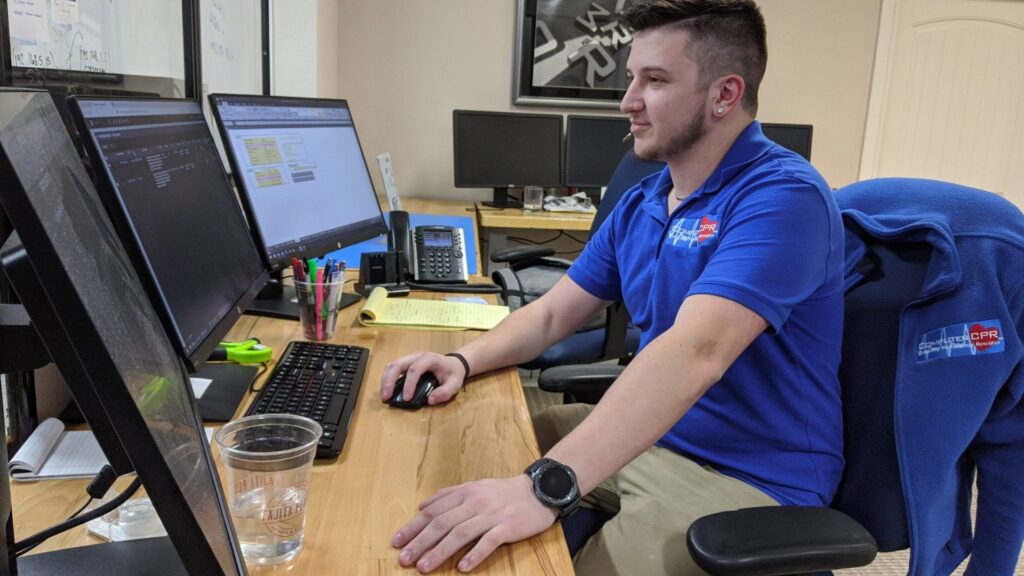 Person working at a desk computer